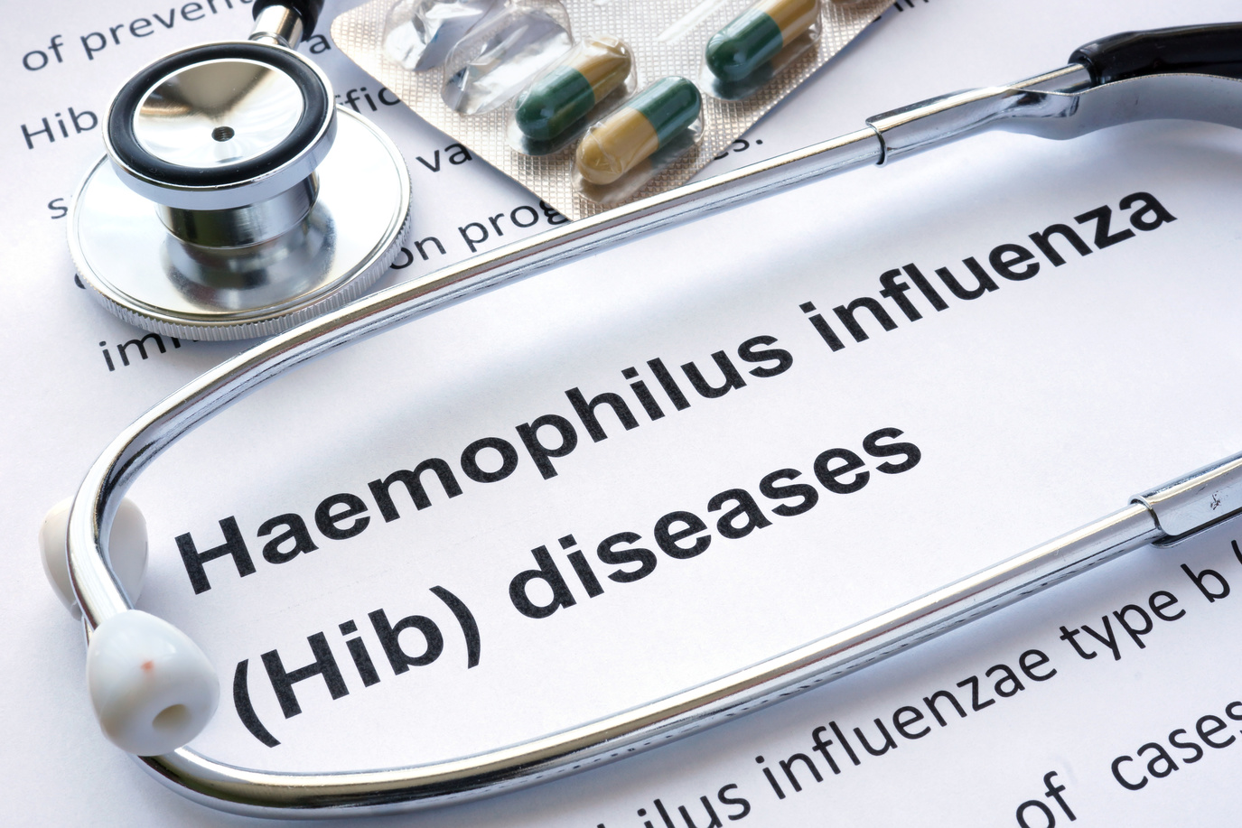 Paper with diagnosis Haemophilus influenza (Hib) diseases and stethoscope.